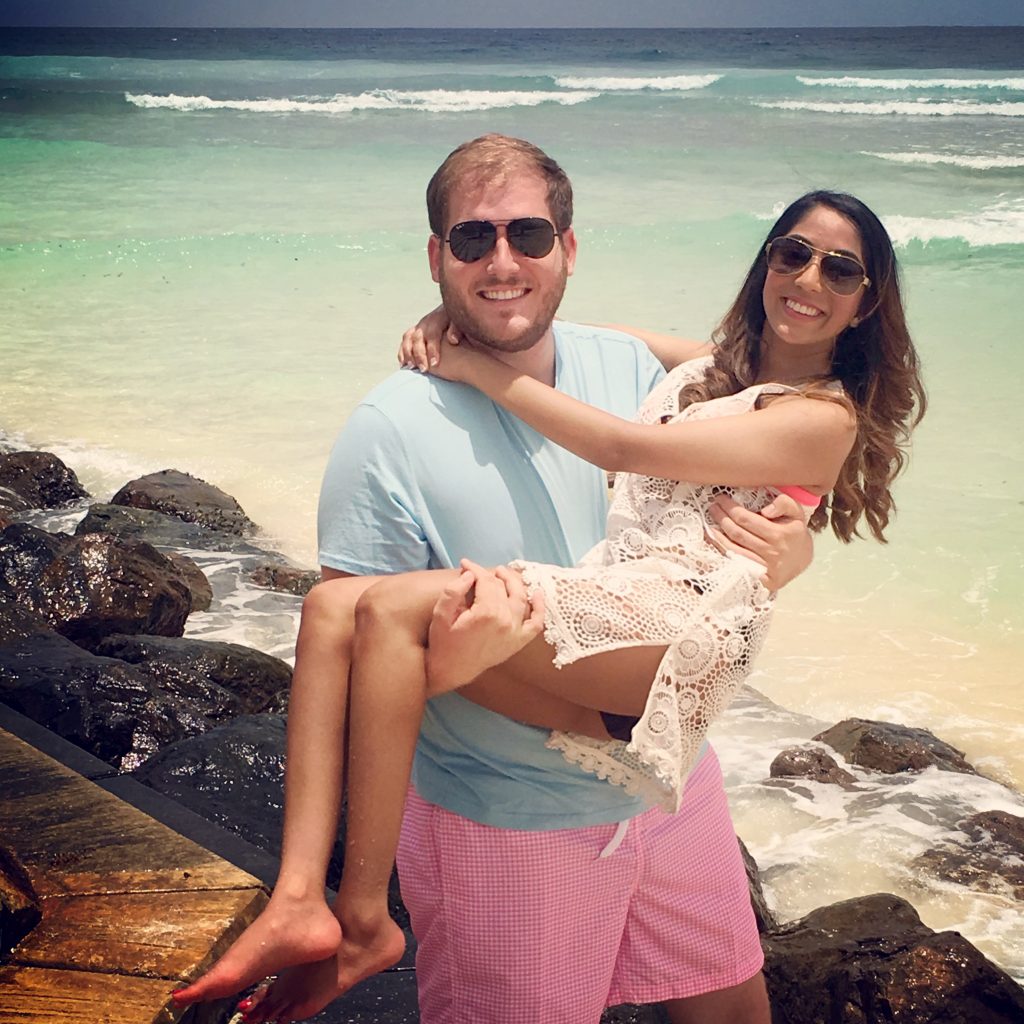 A photo of me and my husband on a beach in Barbados