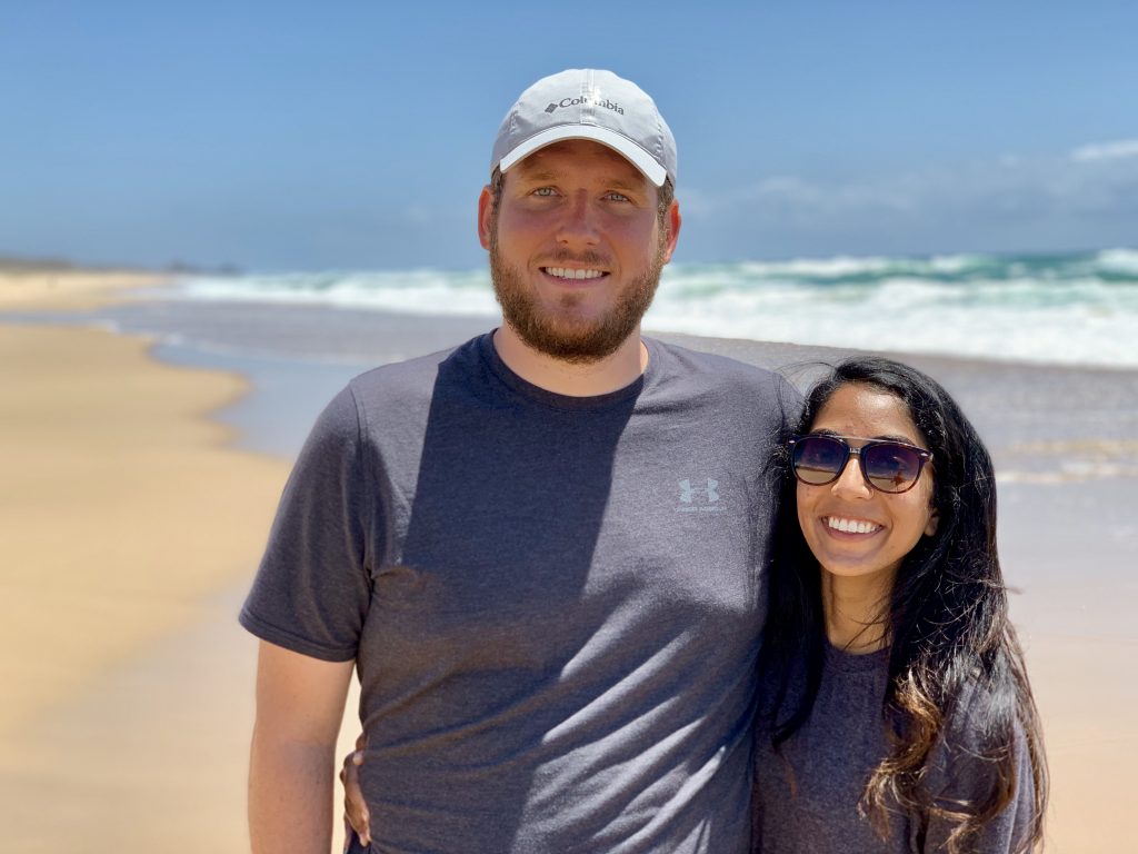 a picture of me and my husband on a beach in australia