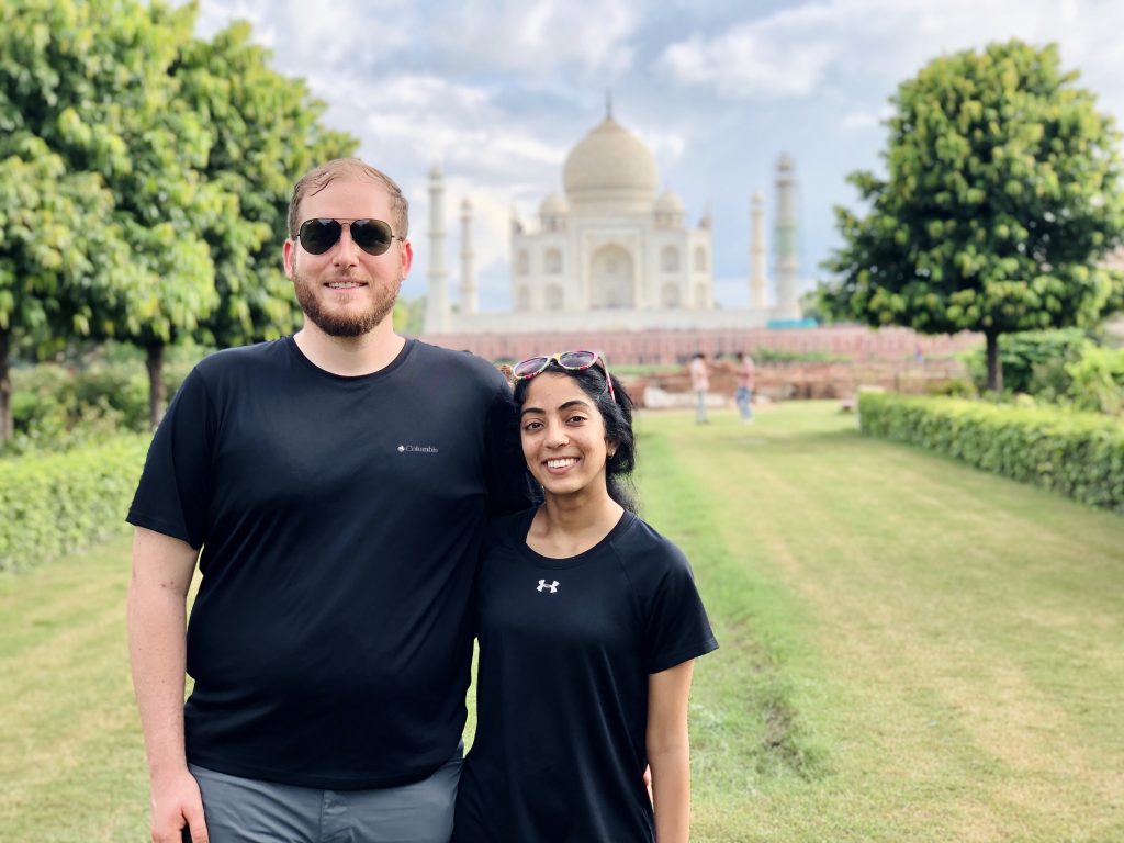 A photo of us standing in front of the Taj Mahal.