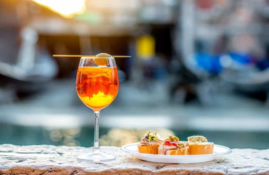 Aperol Spritz and snacks are delicious and one of the best things to know before visiting Venice.