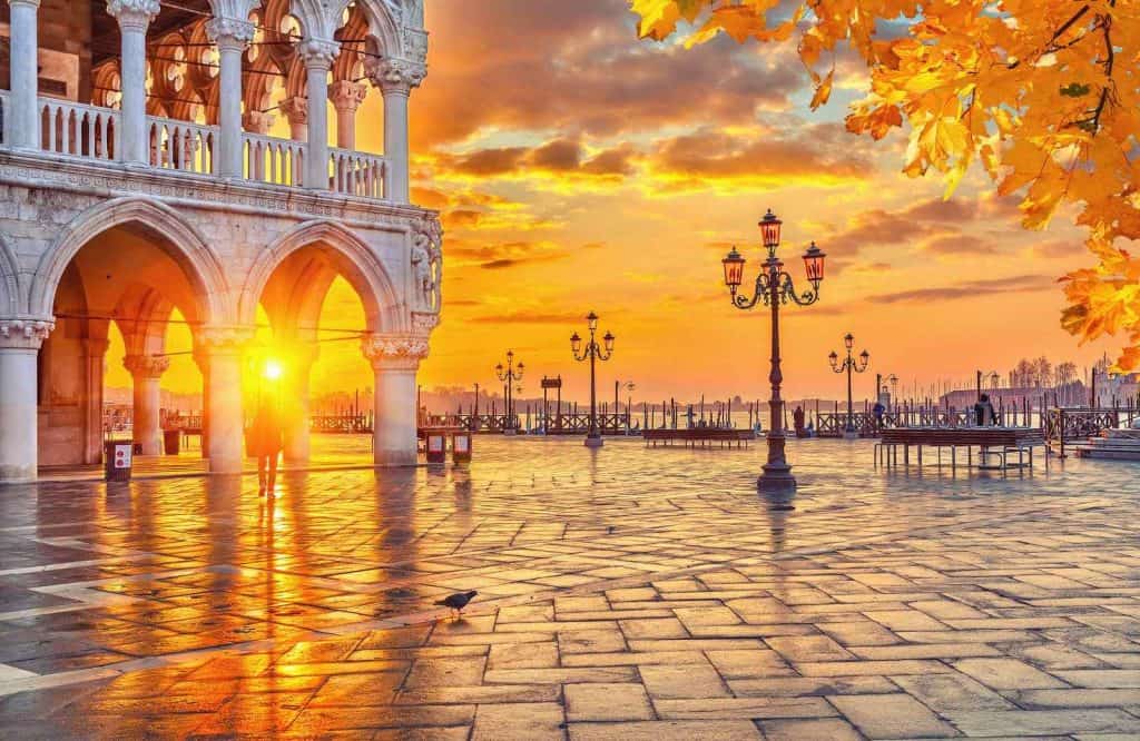 Piazza San Marco at sunrise and one of the most useful things to know before visiting going to Venice is that it's pretty busy at sunrise too.