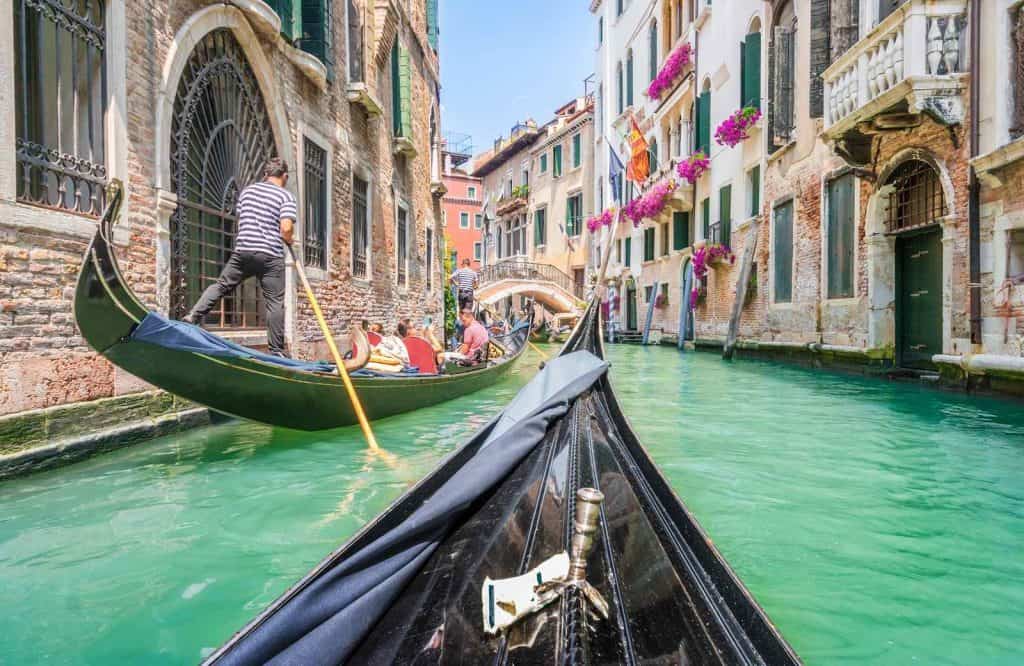 Gondolas in Venice and one of the most important things to know before visiting Venice is to beware of pickpockets.
