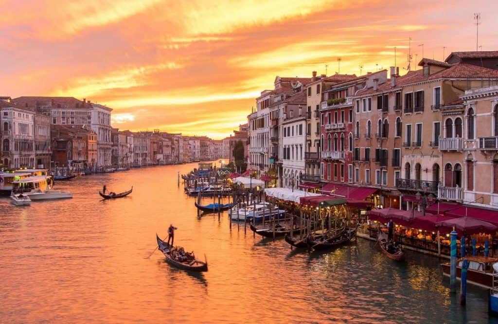 A picturesque Venice canal — one of the most imperative things to know before visiting Venice is to not swim in the canals.
