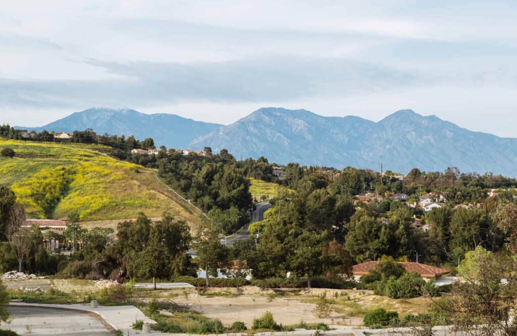 Chino Hills State Park with rolling green rolling hills and mountains.