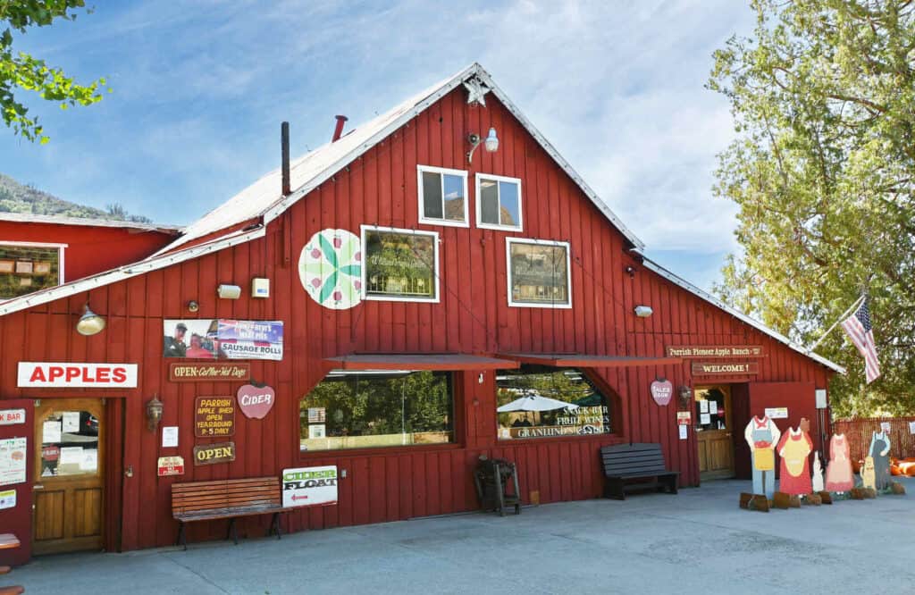 Red barn looking building, which is the Parrish Pioneer Ranch in Oak Glen.