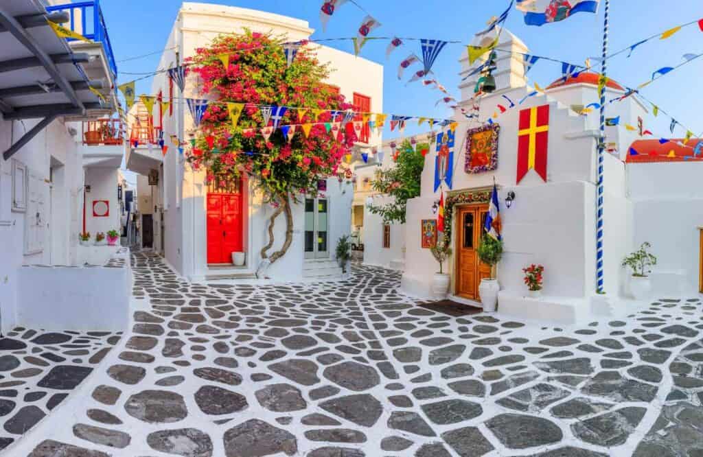The old town of Mykonos with orange doors and cobblestone streets.