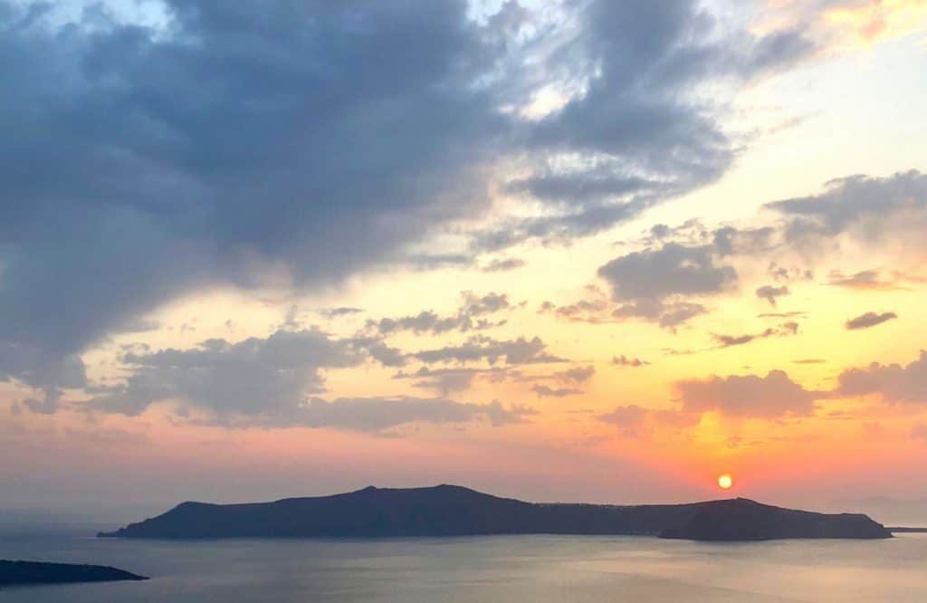 You'll definitely find better sunsets in Santorini than Mykonos!